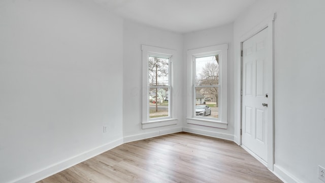 spare room with light hardwood / wood-style floors