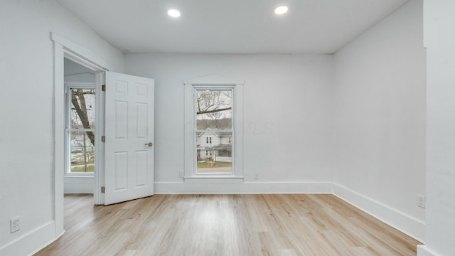 spare room featuring light wood-type flooring