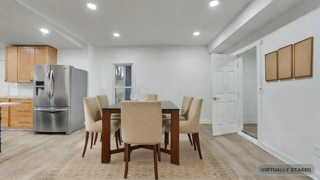 dining area with light hardwood / wood-style flooring