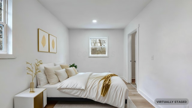 bedroom with light hardwood / wood-style flooring