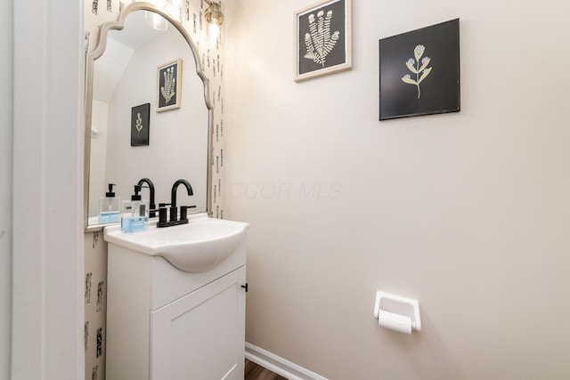 bathroom featuring hardwood / wood-style floors and vanity