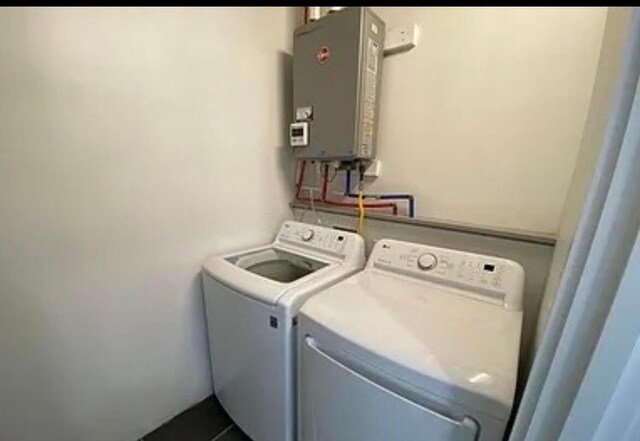 35 E Arcadia Ave, Columbus, OH 43202 - washroom with independent washer and dryer and tankless water heater