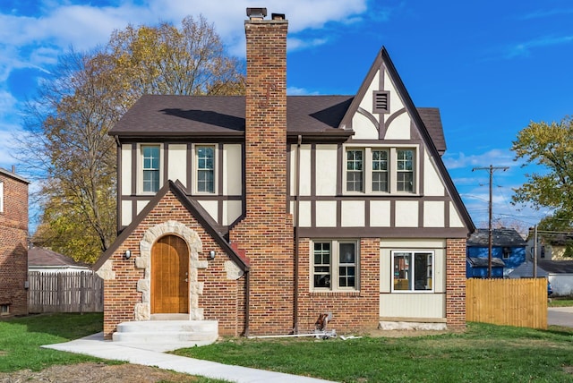 tudor house with a front yard