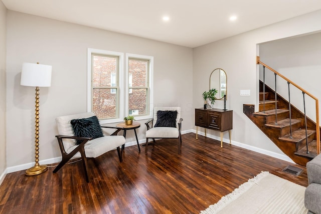 sitting room with hardwood / wood-style flooring