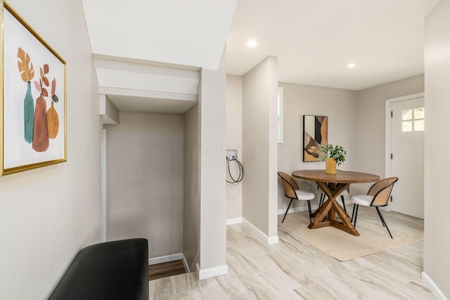 dining space with light hardwood / wood-style floors