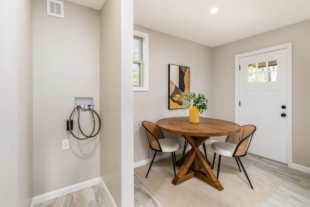 dining space featuring light hardwood / wood-style flooring