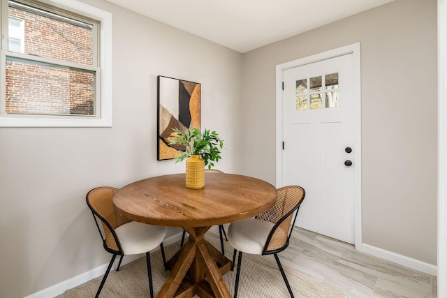 dining space with light wood-type flooring