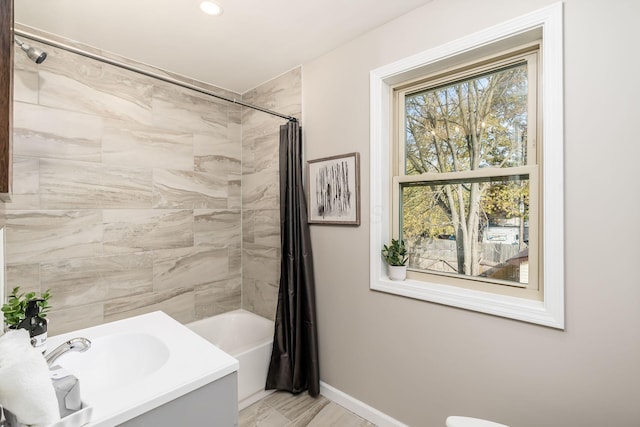 bathroom featuring hardwood / wood-style flooring and shower / tub combo