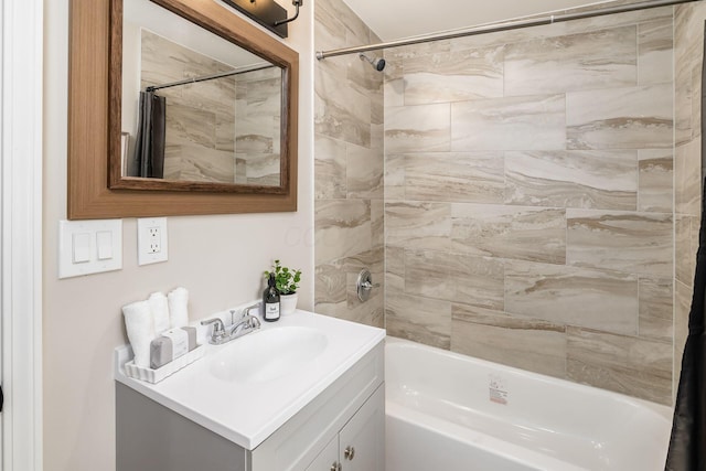 bathroom with shower / bath combo with shower curtain and vanity