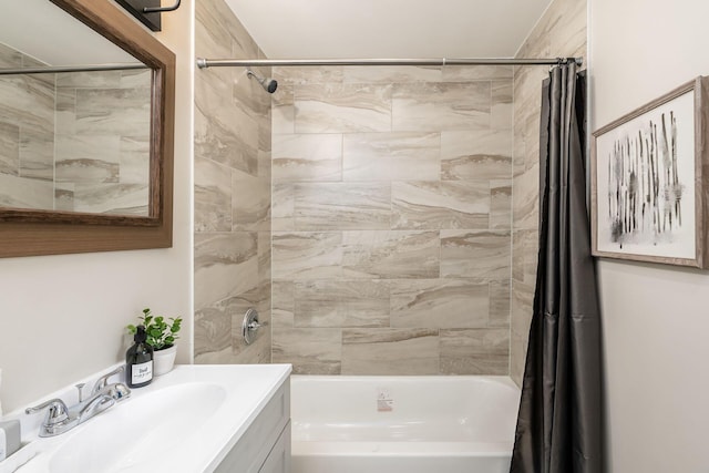 bathroom featuring vanity and shower / bathtub combination with curtain