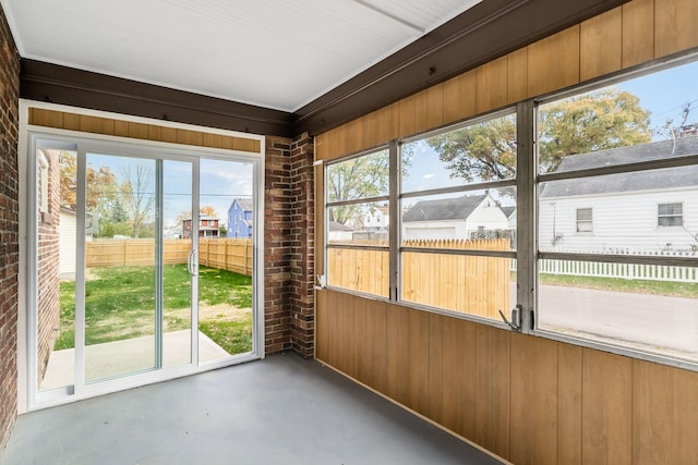 unfurnished sunroom featuring plenty of natural light