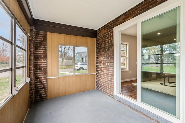 unfurnished sunroom with a healthy amount of sunlight