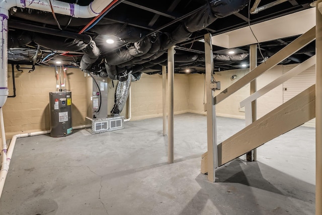 basement with heating unit and water heater