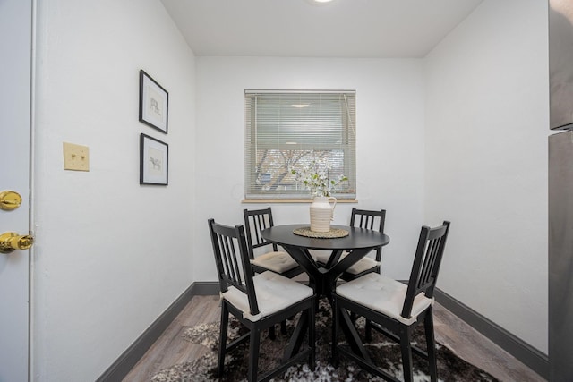 dining area featuring wood-type flooring