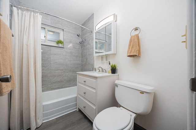 full bathroom featuring vanity, wood-type flooring, shower / bath combo, and toilet