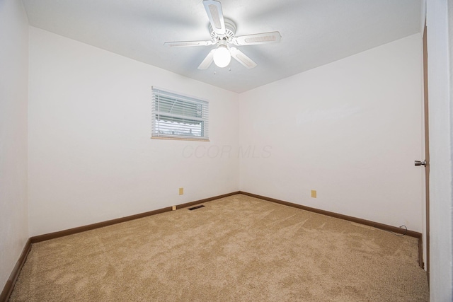 unfurnished room with carpet flooring and ceiling fan