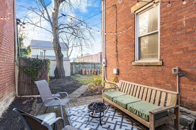 view of patio / terrace with an outdoor fire pit