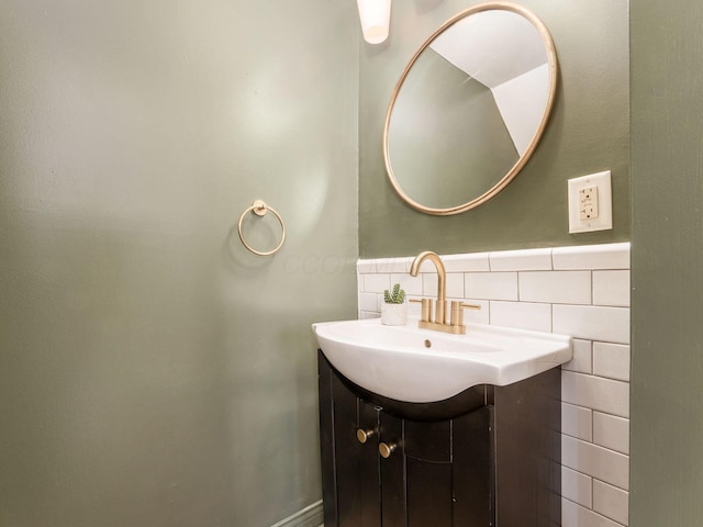 bathroom with sink and tile walls