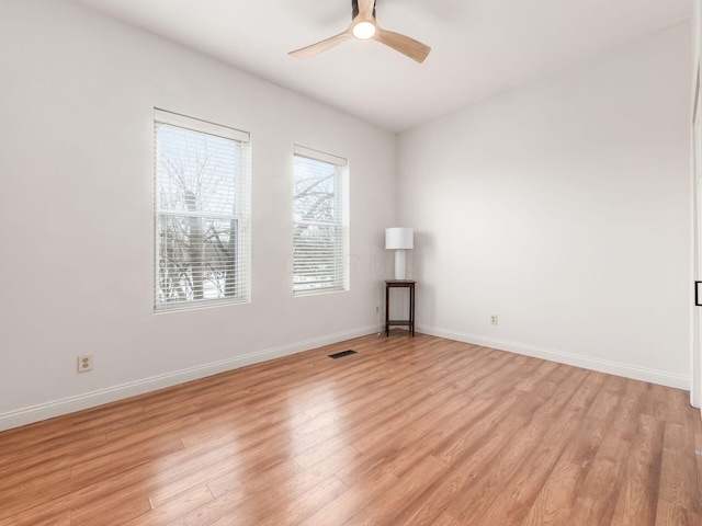 empty room featuring light hardwood / wood-style flooring and ceiling fan