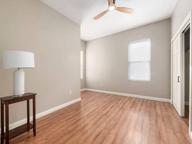 unfurnished bedroom with light wood-type flooring and ceiling fan