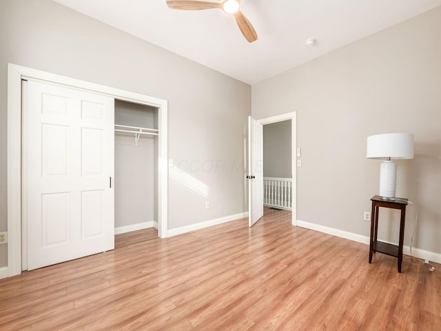 unfurnished bedroom with ceiling fan, light hardwood / wood-style floors, and a closet