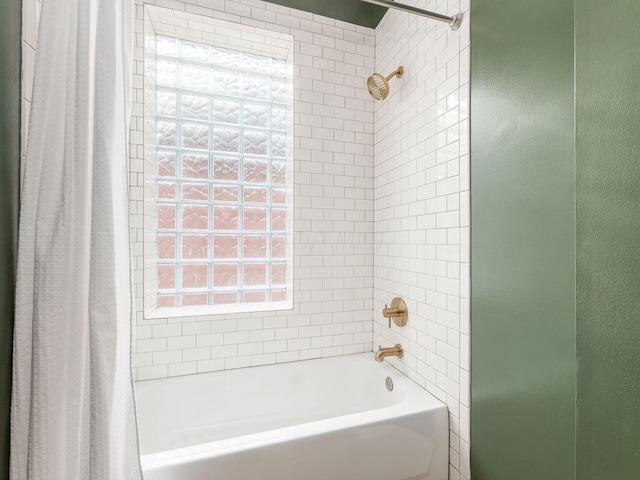 bathroom with shower / tub combo with curtain