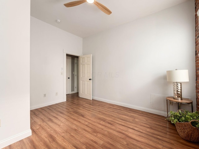 spare room with light hardwood / wood-style flooring and ceiling fan