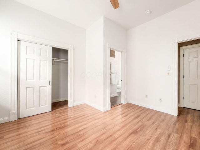 unfurnished bedroom featuring ceiling fan, light hardwood / wood-style flooring, and a closet