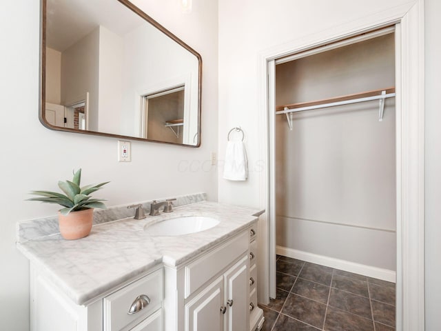 bathroom with tile patterned flooring and vanity