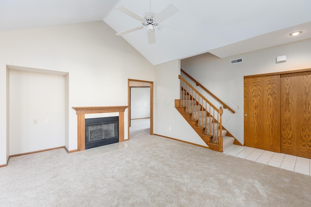 unfurnished living room with light carpet, high vaulted ceiling, and ceiling fan