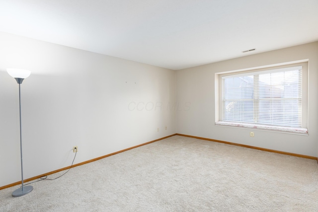 empty room with carpet flooring