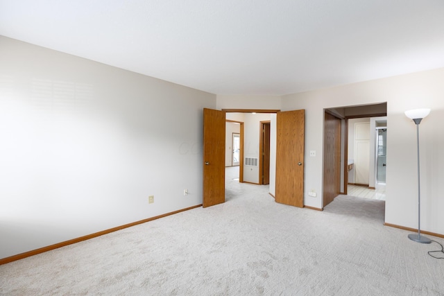 spare room with light colored carpet