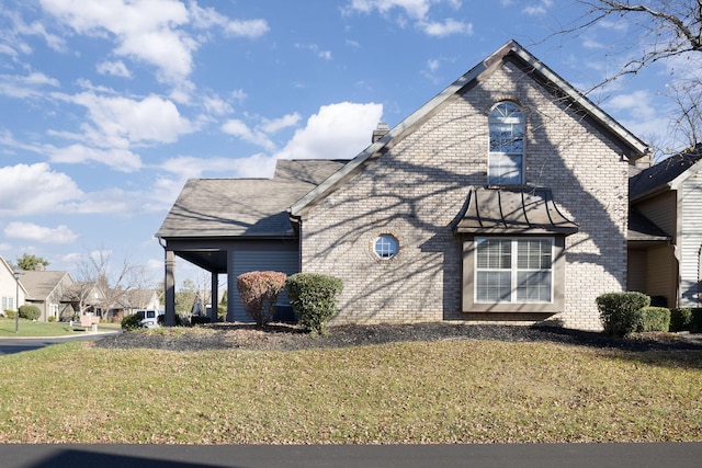 view of side of home featuring a yard