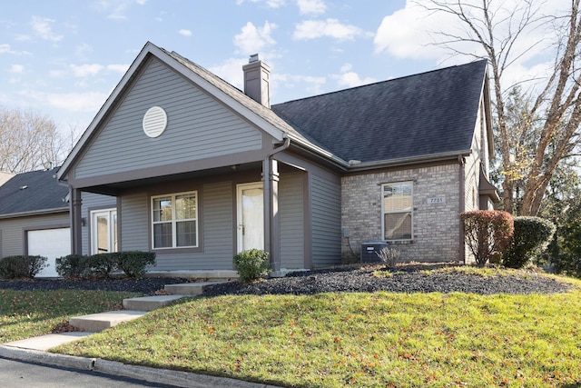 view of front of house featuring a front lawn and a garage