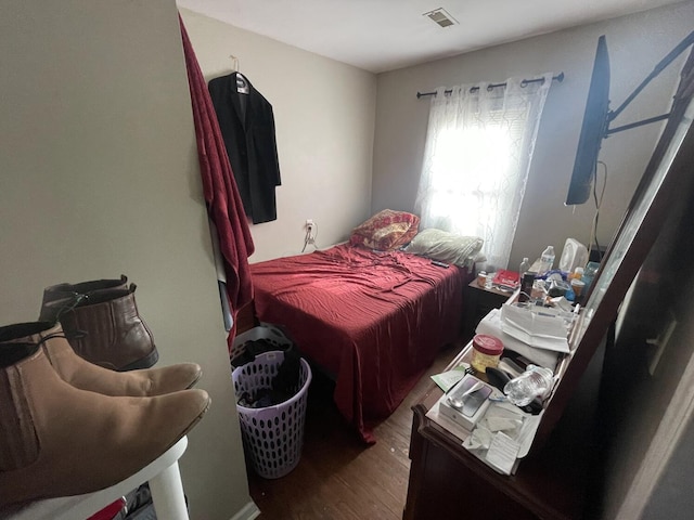 bedroom featuring dark wood-type flooring