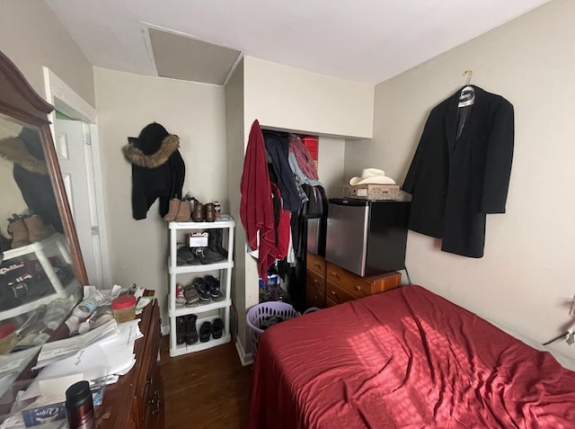 bedroom with dark wood-type flooring