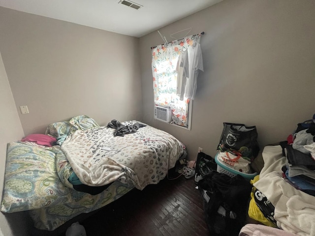 bedroom with hardwood / wood-style floors