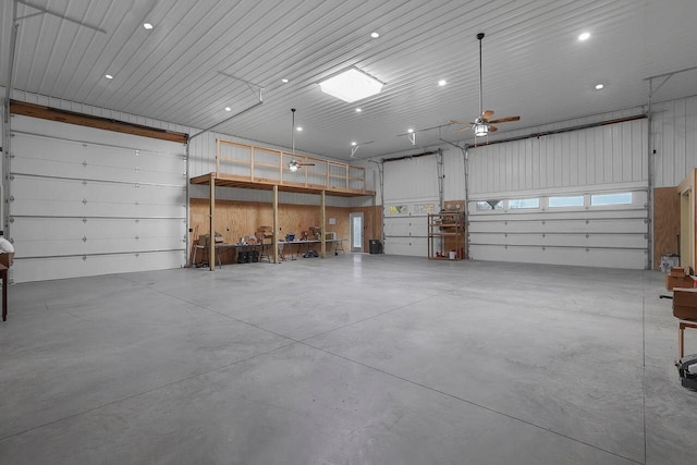 garage with ceiling fan and a garage door opener