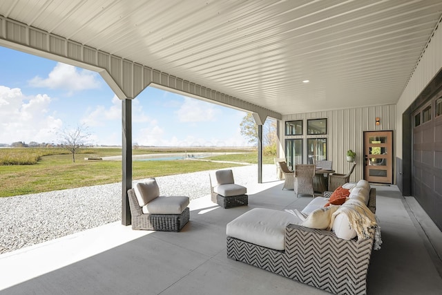 view of patio featuring a water view and an outdoor hangout area