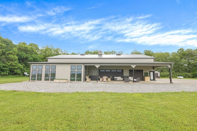 20020 Commercial Point Rd, Circleville, OH 43113 - rear view of property with a yard, metal roof, a chimney, and outdoor lounge area