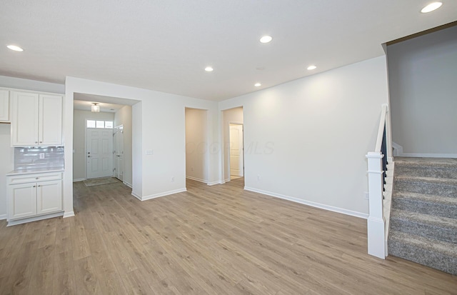 unfurnished living room featuring light wood-type flooring