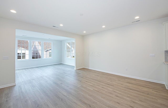 spare room featuring light wood-type flooring