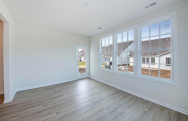 spare room with light wood-type flooring