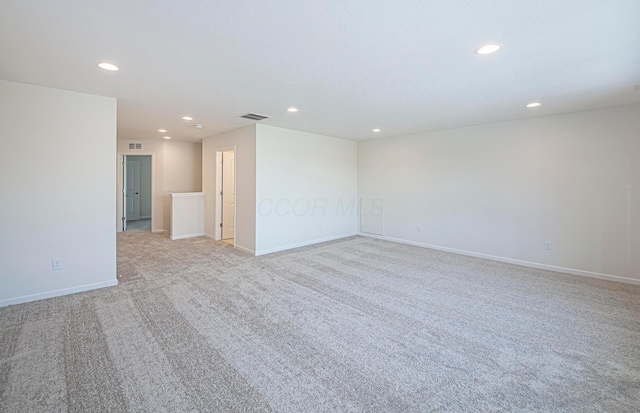 empty room featuring light colored carpet