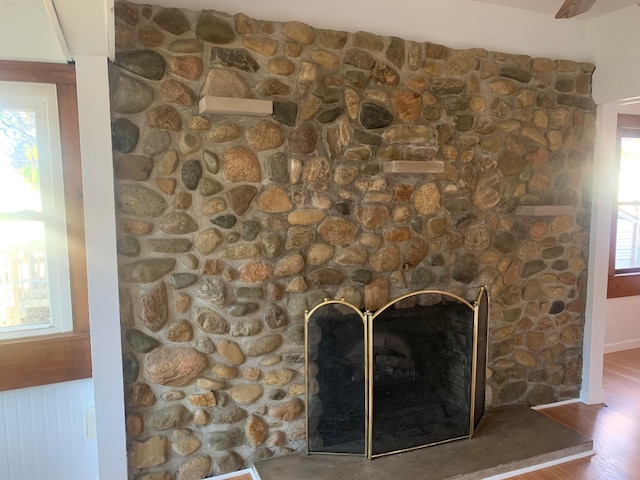 interior details featuring a fireplace and hardwood / wood-style flooring