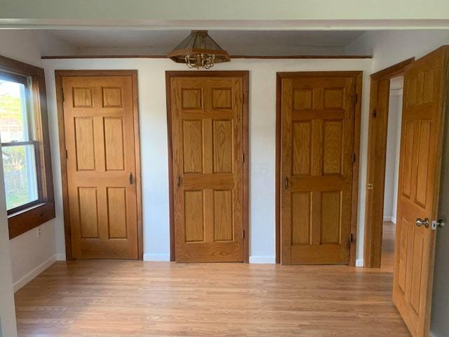 unfurnished bedroom featuring light hardwood / wood-style floors