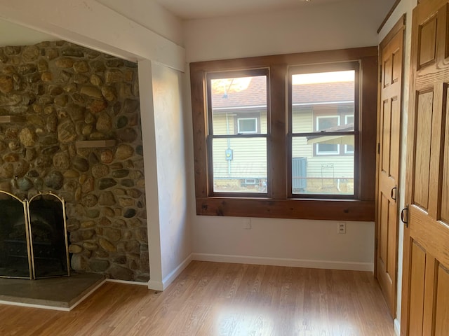 interior space featuring a fireplace and light wood-type flooring