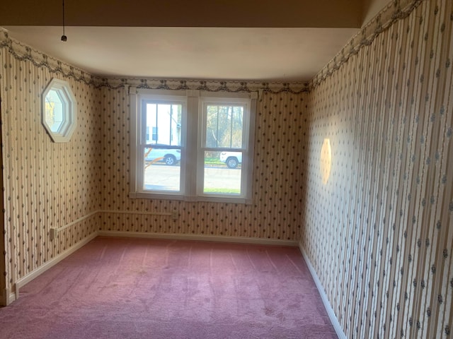 unfurnished room featuring carpet