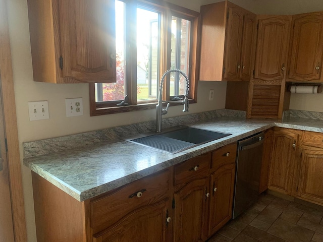 kitchen featuring stainless steel dishwasher and sink