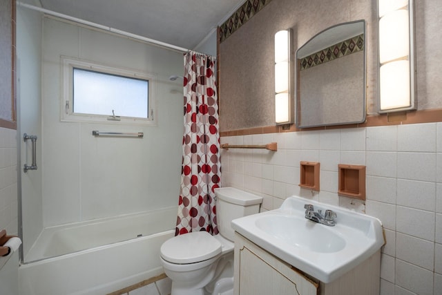 full bath with toilet, tile walls, vanity, and shower / bathtub combination with curtain